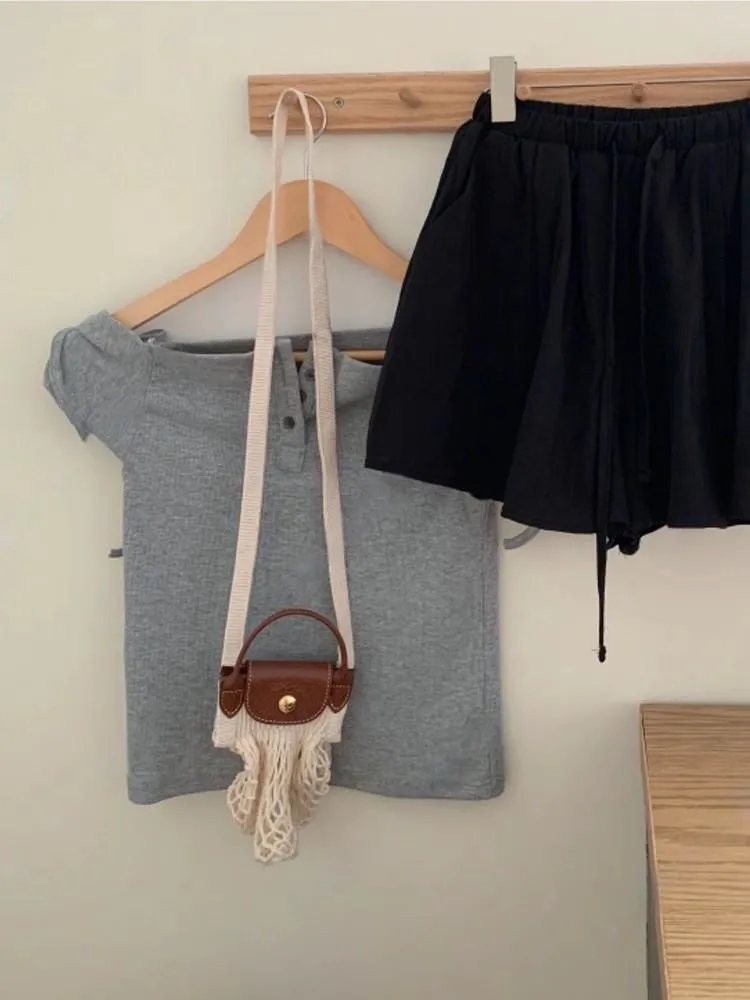 正韓 一字領肩蝴蝶結排釦上衣