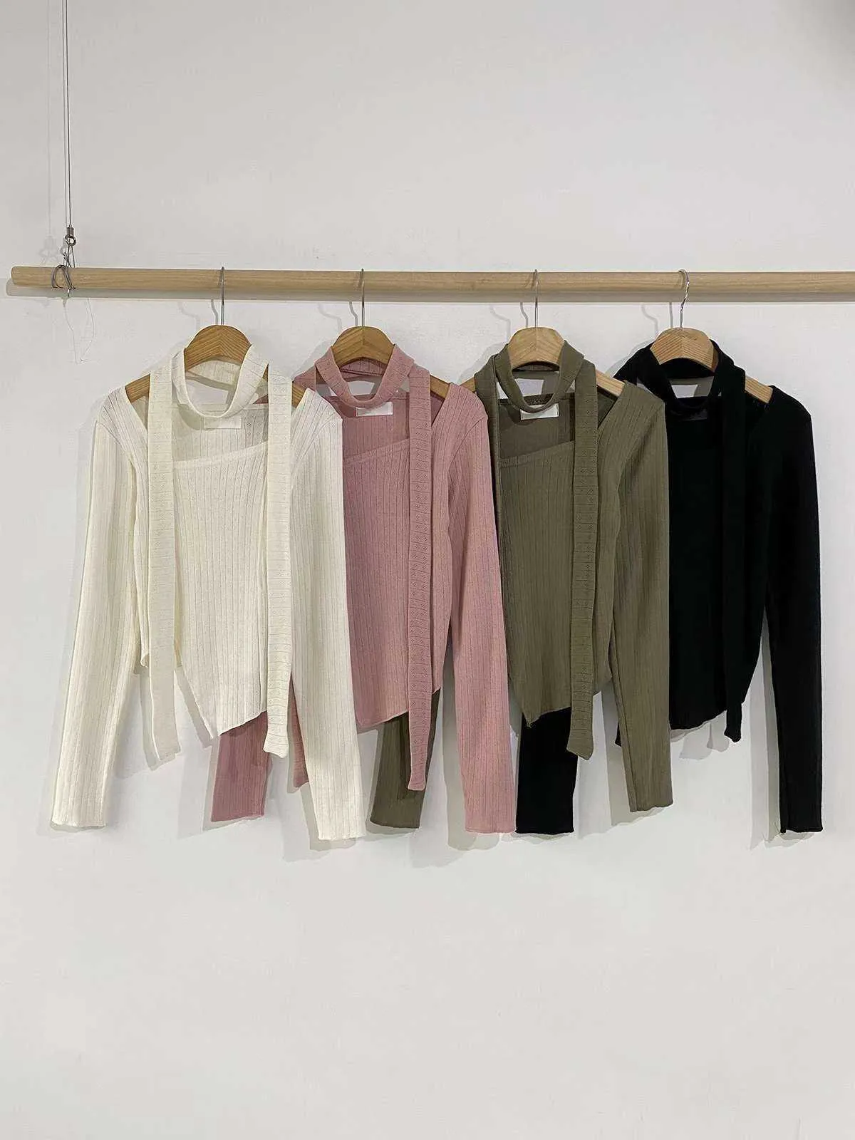 正韓附飄帶立體線條不規則下擺上衣