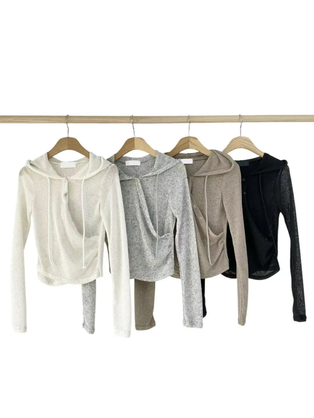 正韓微透膚隨性不規則排釦連帽上衣