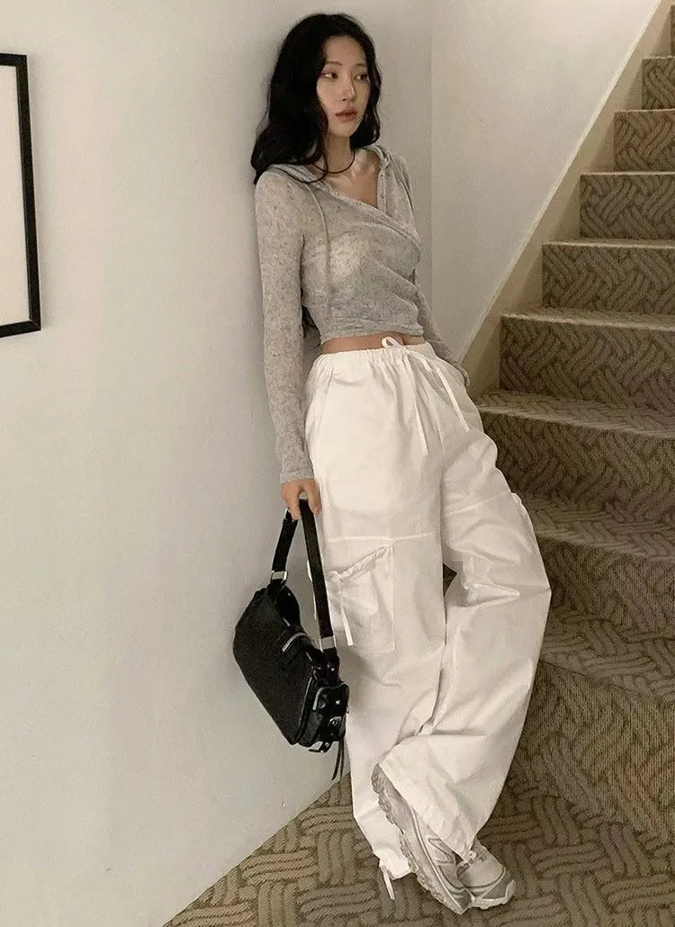 正韓微透膚隨性不規則排釦連帽上衣