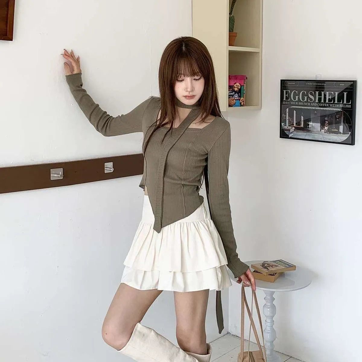 正韓附飄帶立體線條不規則下擺上衣