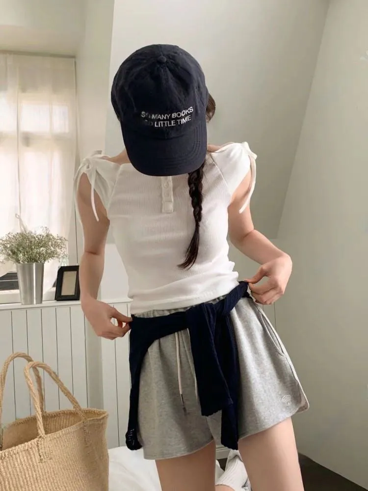 正韓 一字領肩蝴蝶結排釦上衣