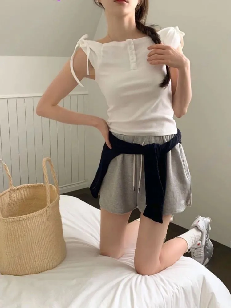 正韓 一字領肩蝴蝶結排釦上衣